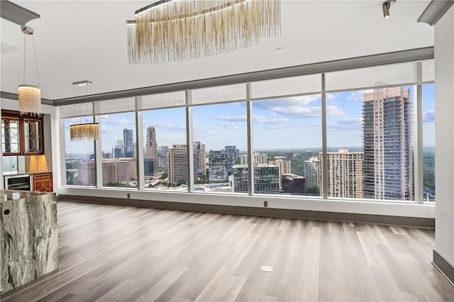 3630 Peachtree Rd NE Unit 2207, Atlanta, GA 30326 - spare room featuring a view of skyline and wood finished floors