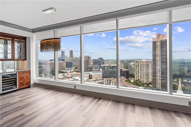 3630 Peachtree Rd NE Unit 2207, Atlanta, GA 30326 - sunroom / solarium with wine cooler, a city view, and plenty of natural light