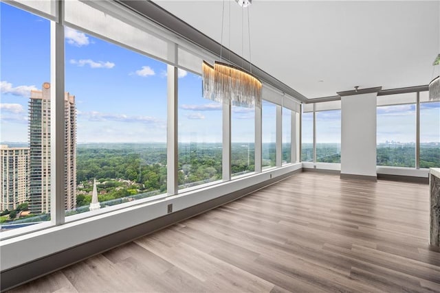 3630 Peachtree Rd NE Unit 2207, Atlanta, GA 30326 - unfurnished sunroom featuring healthy amount of natural light and wood finished floors