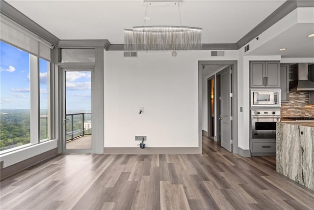 3630 Peachtree Rd NE Unit 2207, Atlanta, GA 30326 - unfurnished dining area with wood finished floors and baseboards