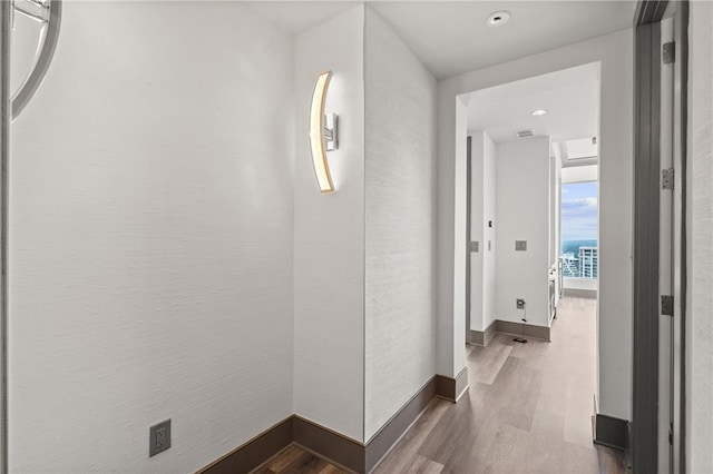 3630 Peachtree Rd NE Unit 2207, Atlanta, GA 30326 - hallway with wood finished floors, baseboards, and recessed lighting