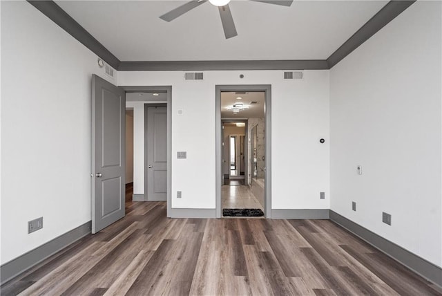 3630 Peachtree Rd NE Unit 2207, Atlanta, GA 30326 - unfurnished bedroom with wood finished floors, baseboards, and a ceiling fan