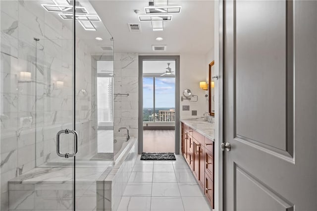 3630 Peachtree Rd NE Unit 2207, Atlanta, GA 30326 - full bath with marble look tiles, a bath, vanity, and a marble finish shower