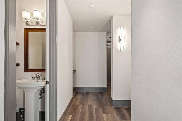 3630 Peachtree Rd NE Unit 2207, Atlanta, GA 30326 - hall featuring dark wood-type flooring, a sink, and baseboards