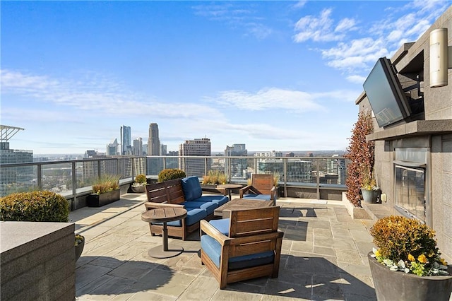 3630 Peachtree Rd NE Unit 2207, Atlanta, GA 30326 - view of patio featuring an outdoor living space with a fire pit