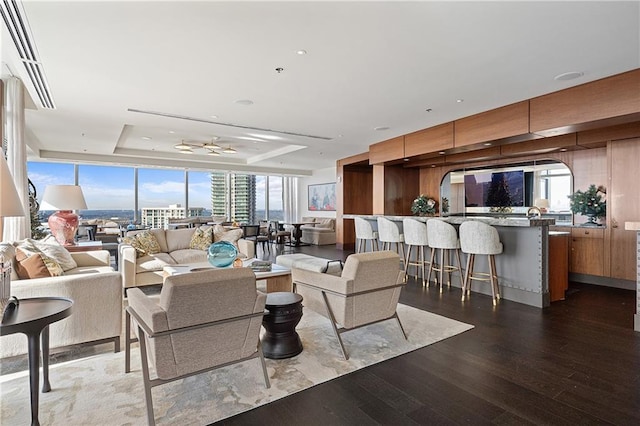 3630 Peachtree Rd NE Unit 2207, Atlanta, GA 30326 - living area featuring a tray ceiling and wood finished floors