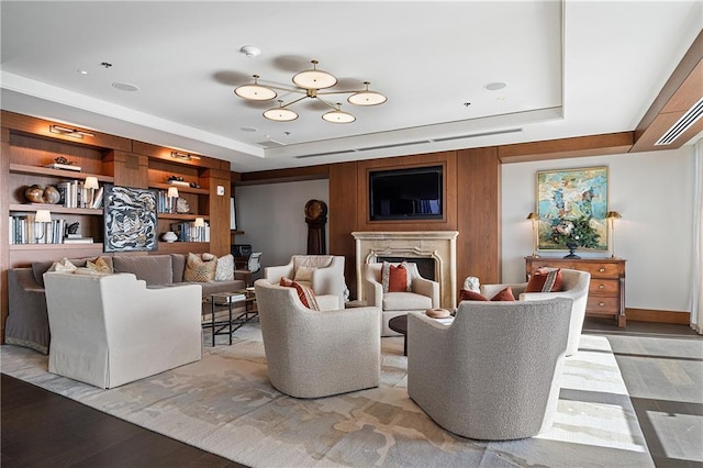 3630 Peachtree Rd NE Unit 2207, Atlanta, GA 30326 - living room featuring a raised ceiling, light wood finished floors, and a fireplace