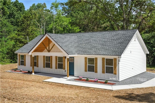 376 Wayside Ln, Dallas, GA 30132 - modern farmhouse featuring roof with shingles and board and batten siding