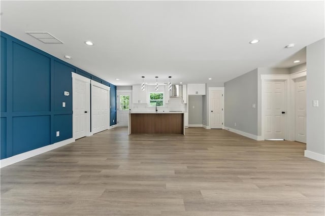 376 Wayside Ln, Dallas, GA 30132 - unfurnished living room featuring recessed lighting and light wood-type flooring