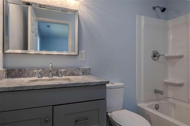 full bathroom with shower / bathtub combination, vanity, and toilet