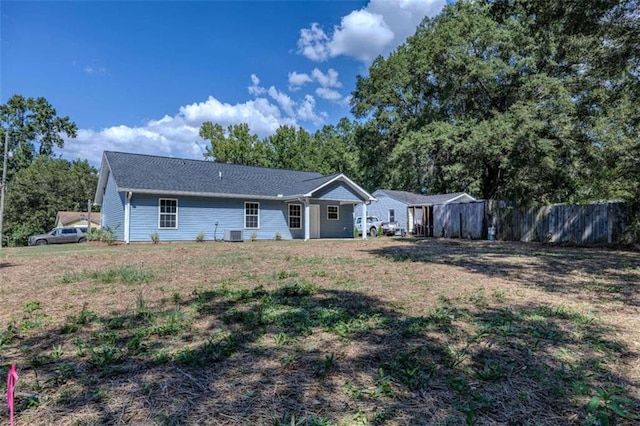 single story home featuring central AC unit