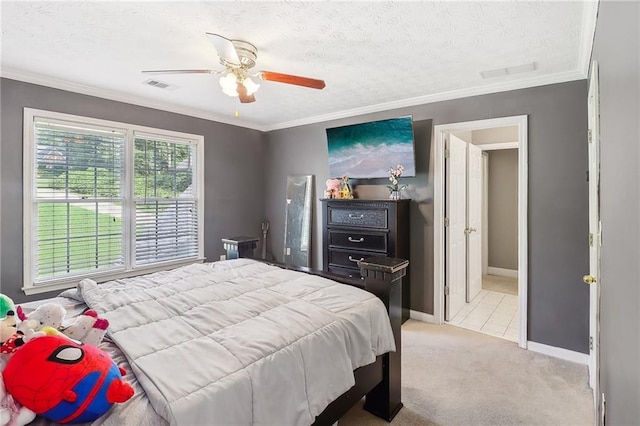 bedroom featuring crown molding, light carpet, ceiling fan, and a textured ceiling