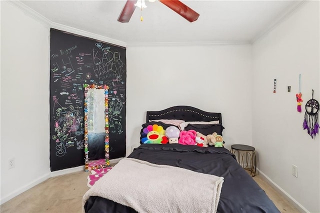 bedroom featuring crown molding, ceiling fan, and light carpet