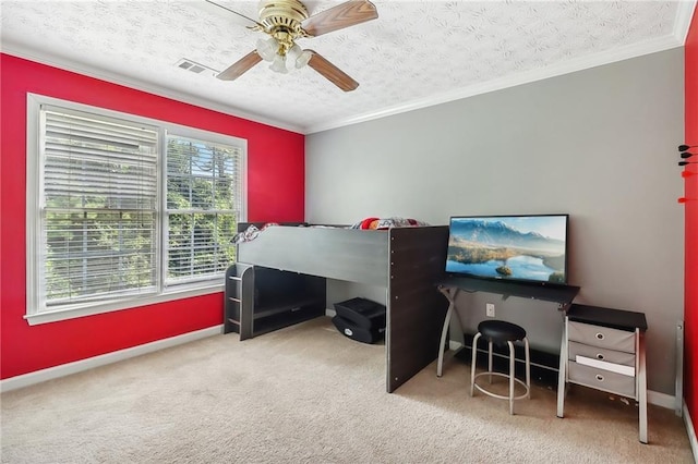 bedroom featuring ornamental molding, carpet, and a textured ceiling