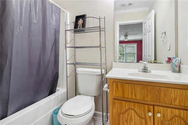 full bathroom with shower / tub combo with curtain, ornamental molding, toilet, and vanity