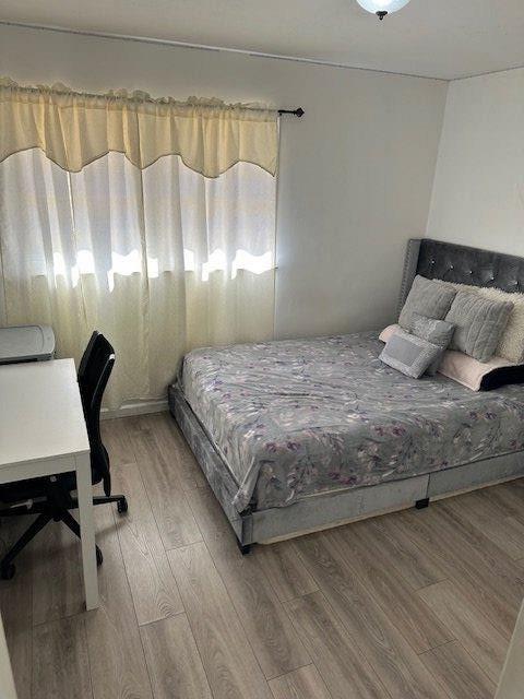 bedroom with light wood-style flooring