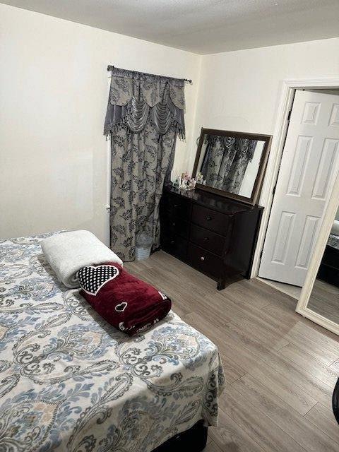 bedroom featuring wood finished floors