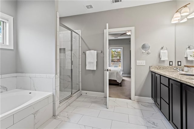 bathroom with ceiling fan, vanity, and independent shower and bath