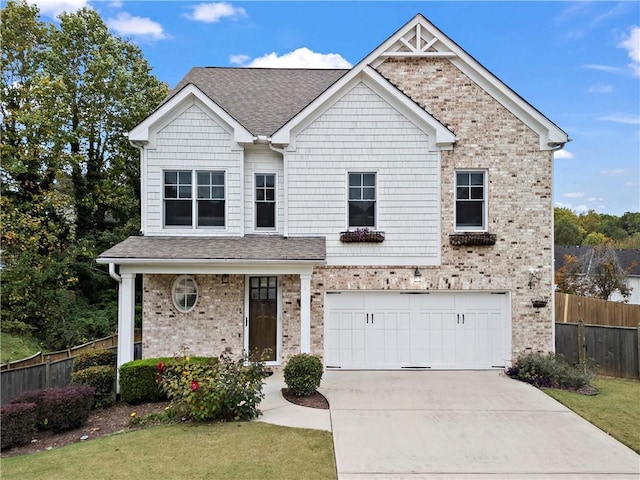 view of front of house with a front yard and a garage