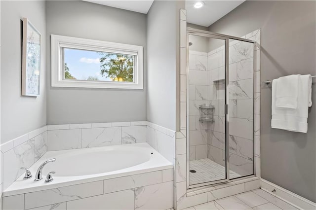 bathroom with separate shower and tub