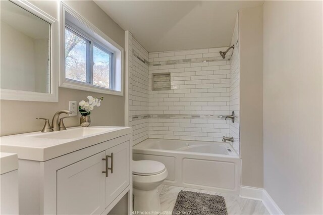 385 Arthur St SW, Atlanta, GA 30310 - bathroom with vanity, toilet, washtub / shower combination, and marble finish floor