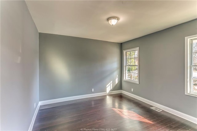 385 Arthur St SW, Atlanta, GA 30310 - empty room featuring visible vents, baseboards, and dark wood-style flooring