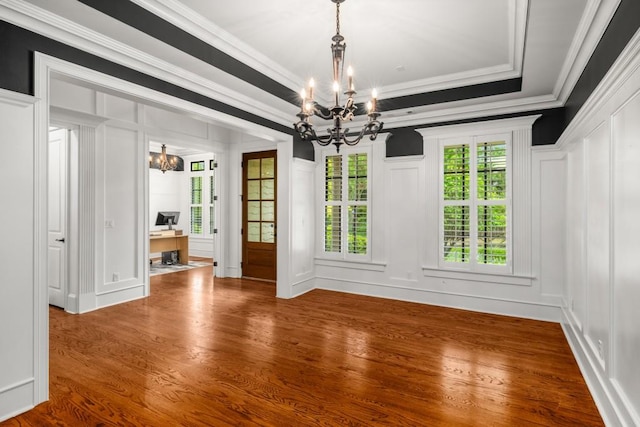 201 Hunley Ct, Alpharetta, GA 30005 - unfurnished dining area featuring dark wood finished floors, a decorative wall, ornamental molding, and a chandelier