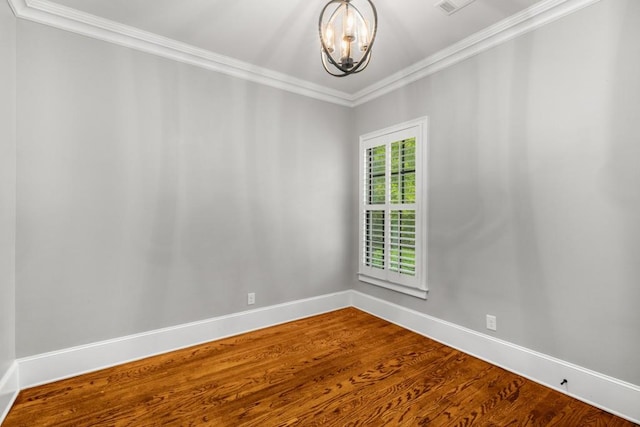 201 Hunley Ct, Alpharetta, GA 30005 - empty room featuring a chandelier, crown molding, baseboards, and dark wood-style flooring