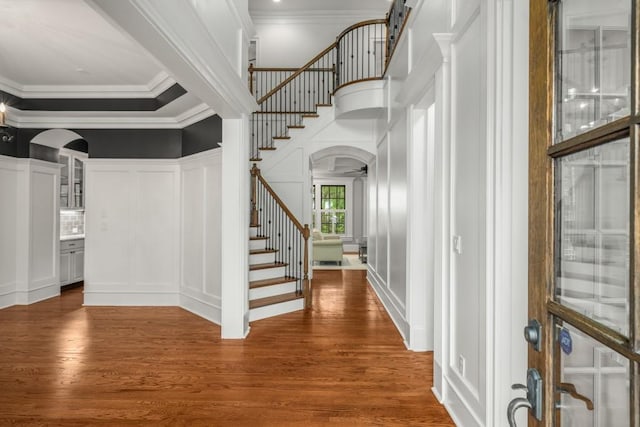 201 Hunley Ct, Alpharetta, GA 30005 - foyer with wood finished floors, arched walkways, stairway, and a decorative wall