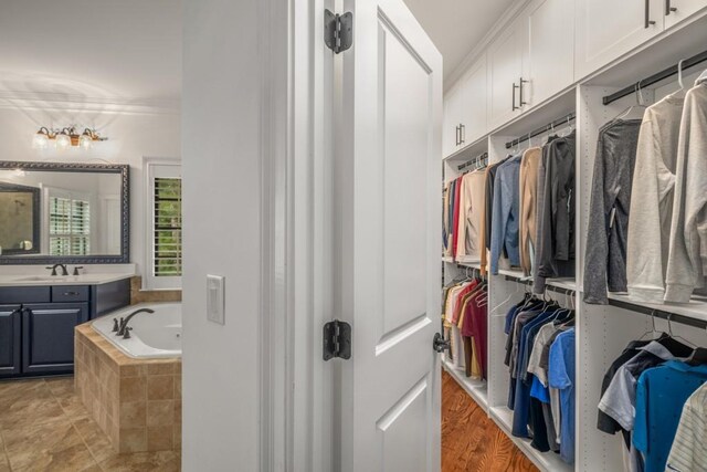 201 Hunley Ct, Alpharetta, GA 30005 - walk in closet featuring a sink