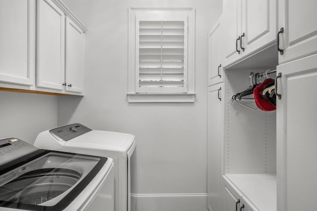 201 Hunley Ct, Alpharetta, GA 30005 - washroom with washing machine and dryer, baseboards, and cabinet space