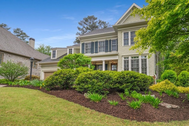 201 Hunley Ct, Alpharetta, GA 30005 - traditional-style house featuring a front yard and a garage