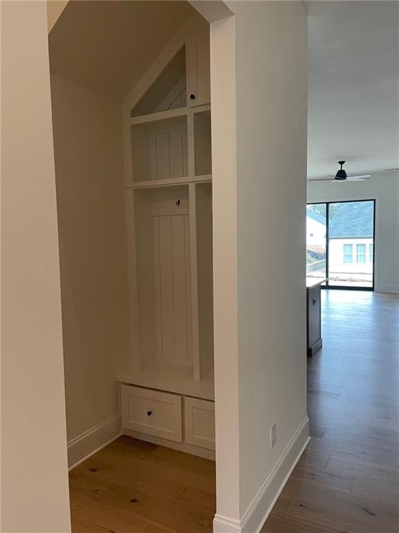 mudroom with ceiling fan and light hardwood / wood-style flooring