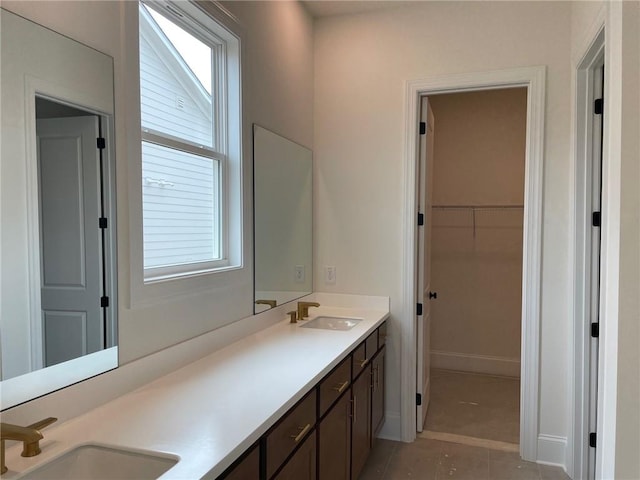 bathroom with vanity and tile patterned flooring