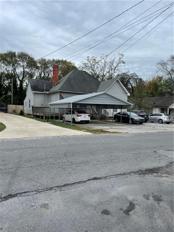 exterior space with fence and a chimney