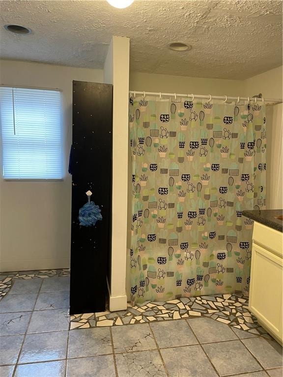 304 E 19th St SW, Rome, GA 30161 - bathroom featuring a textured ceiling, vanity, and a shower with shower curtain