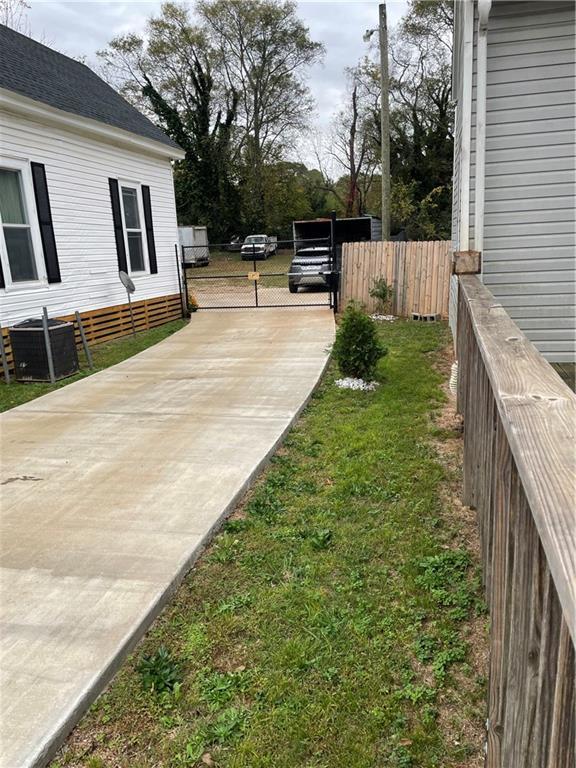 304 E 19th St SW, Rome, GA 30161 - view of yard with central air condition unit and concrete driveway