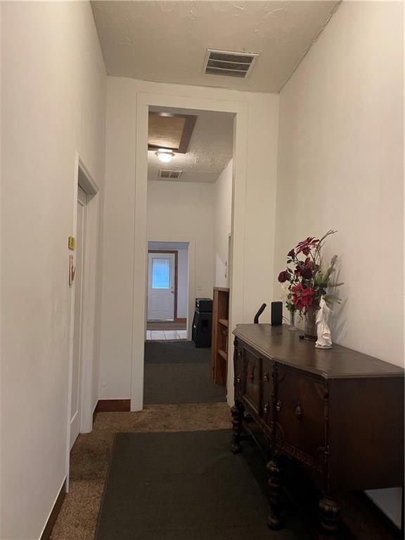 304 E 19th St SW, Rome, GA 30161 - corridor with attic access and carpet flooring