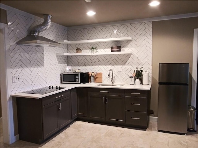 kitchen featuring appliances with stainless steel finishes, sink, light tile patterned floors, and decorative backsplash