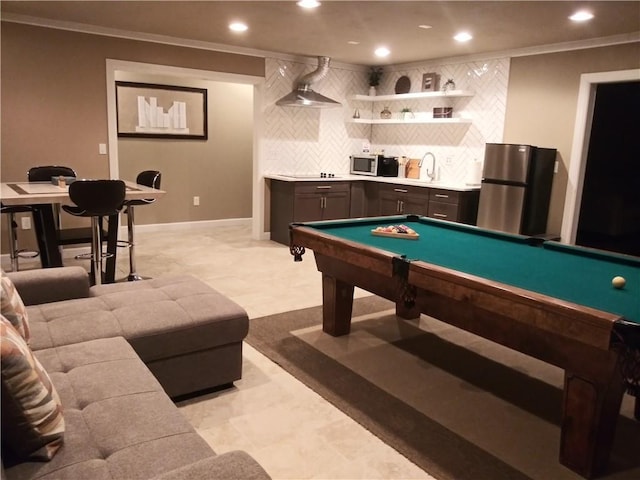 game room with billiards, ornamental molding, and wet bar