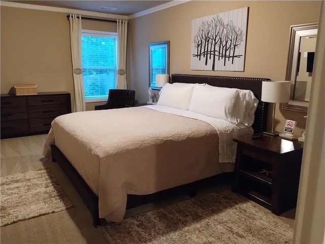 bedroom with ornamental molding