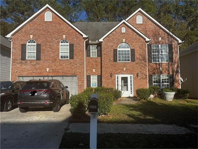 view of front of property with a garage and a front yard