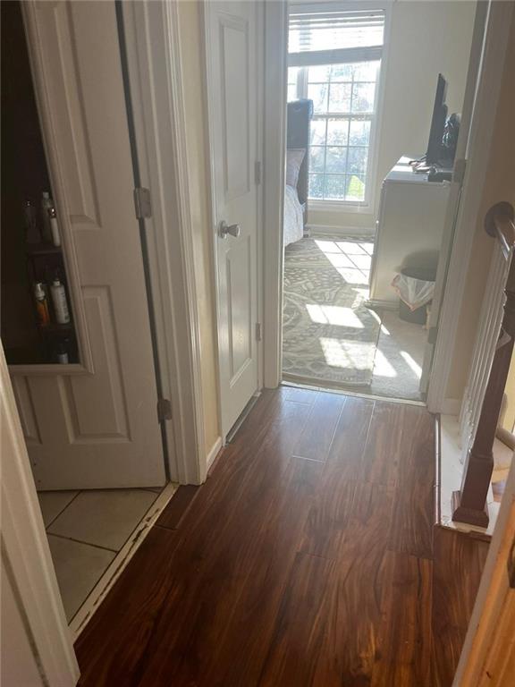 corridor featuring dark hardwood / wood-style flooring