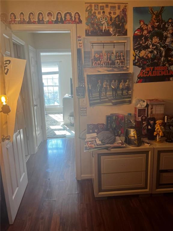 hallway with dark wood-type flooring