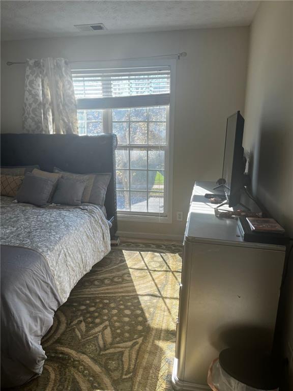 bedroom featuring a textured ceiling