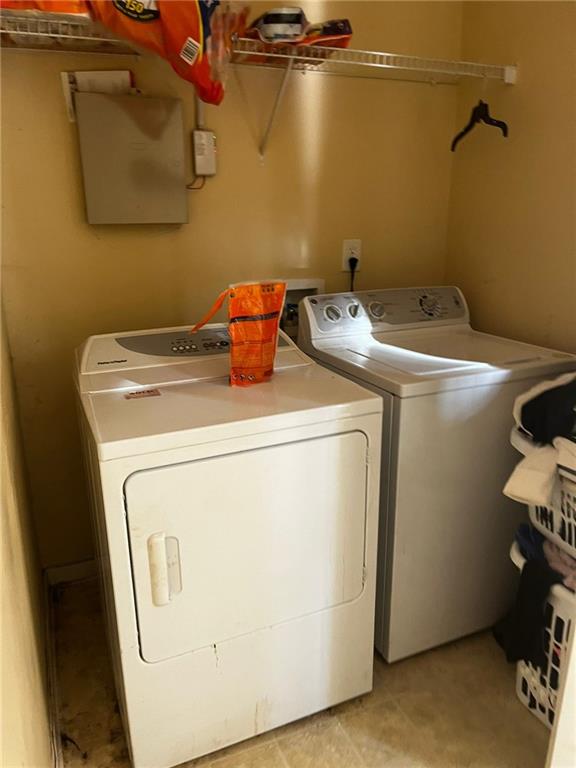 laundry room with independent washer and dryer