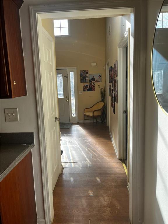 hallway with dark hardwood / wood-style floors