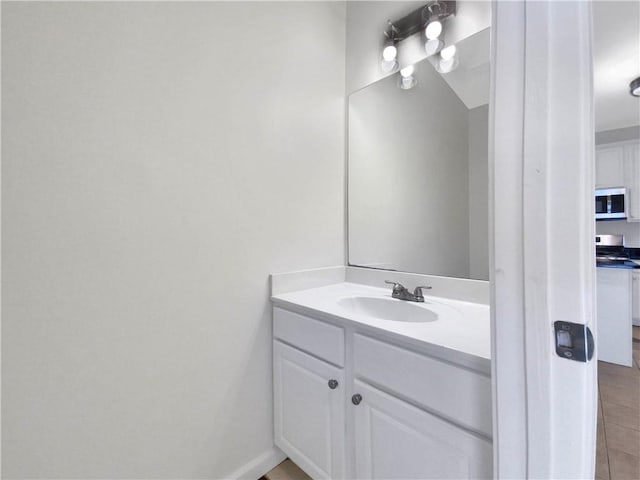 bathroom with vanity and tile patterned flooring