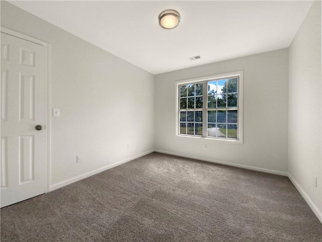 empty room with carpet flooring