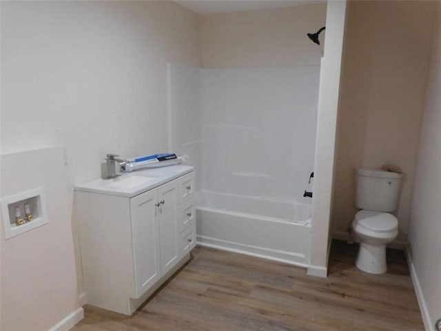 476 W Franklin St, Toccoa, GA 30577 - bathroom featuring wood finished floors, vanity, and shower / washtub combination